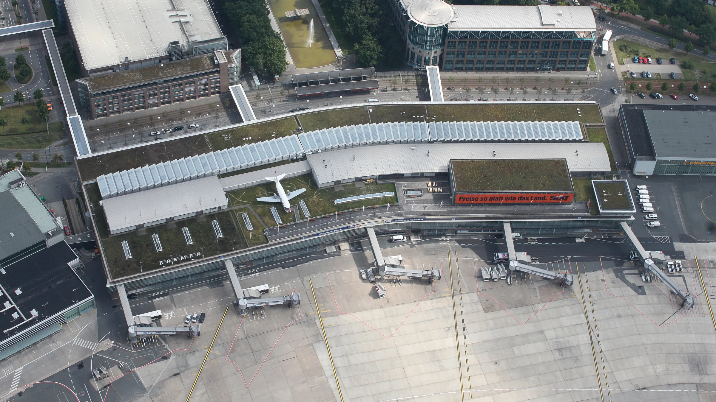 Bremen Airport from the air, aircraft at the terminal jet bridges
