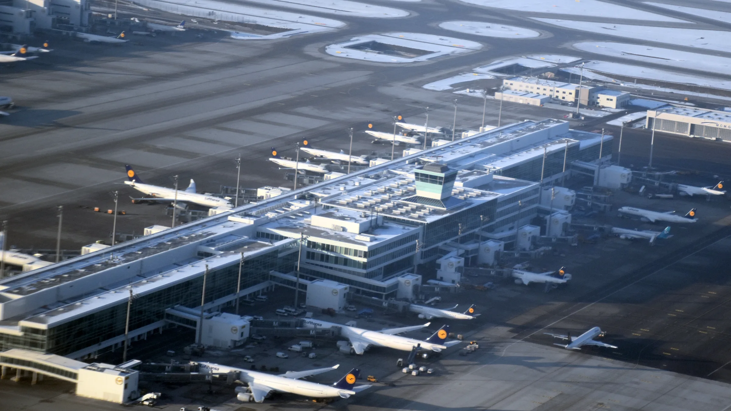 The terminal satellite at Munich Airport from the air, an aircraft at every stand