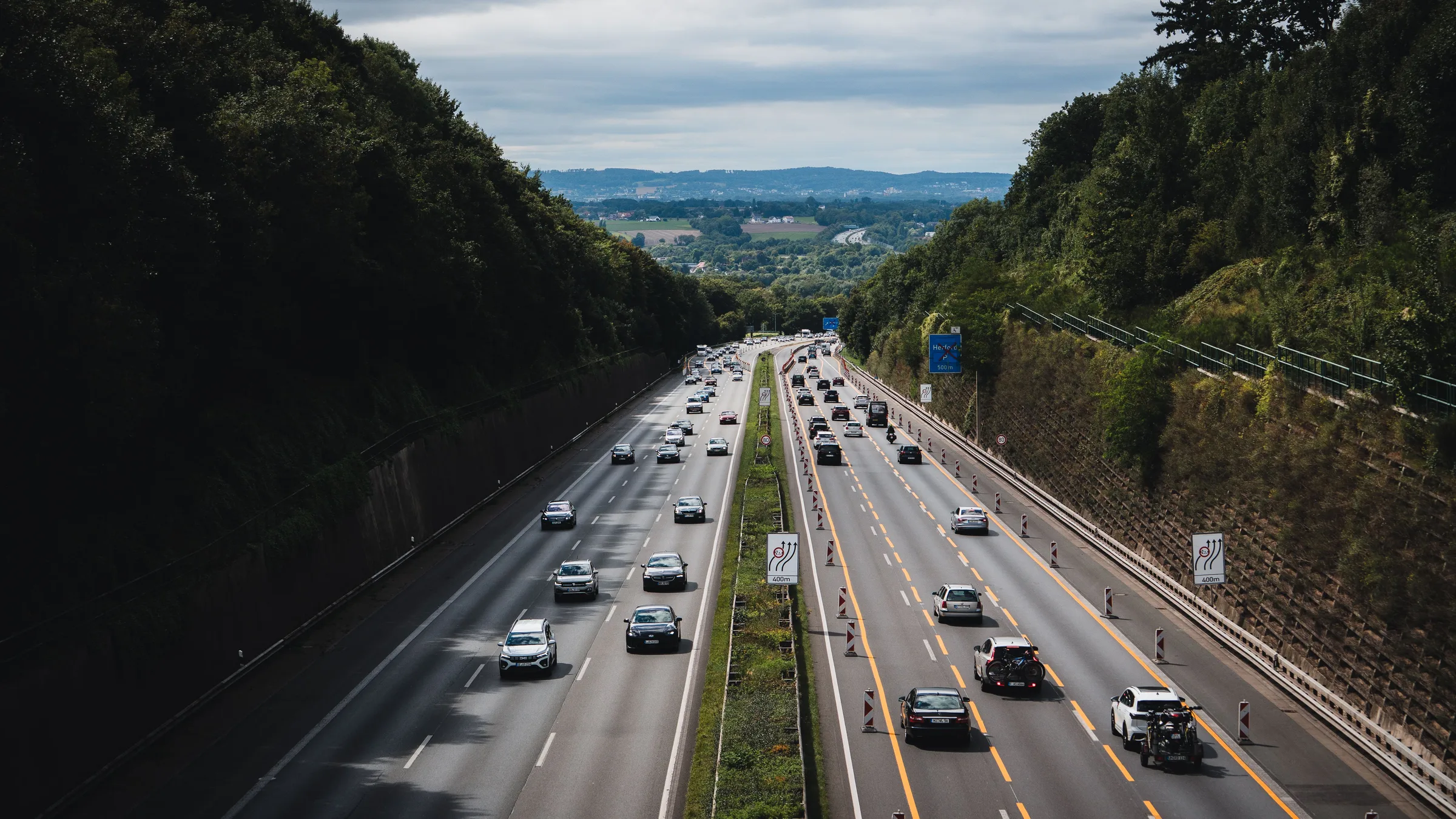 A German autobahn curving through forest — How the price is set